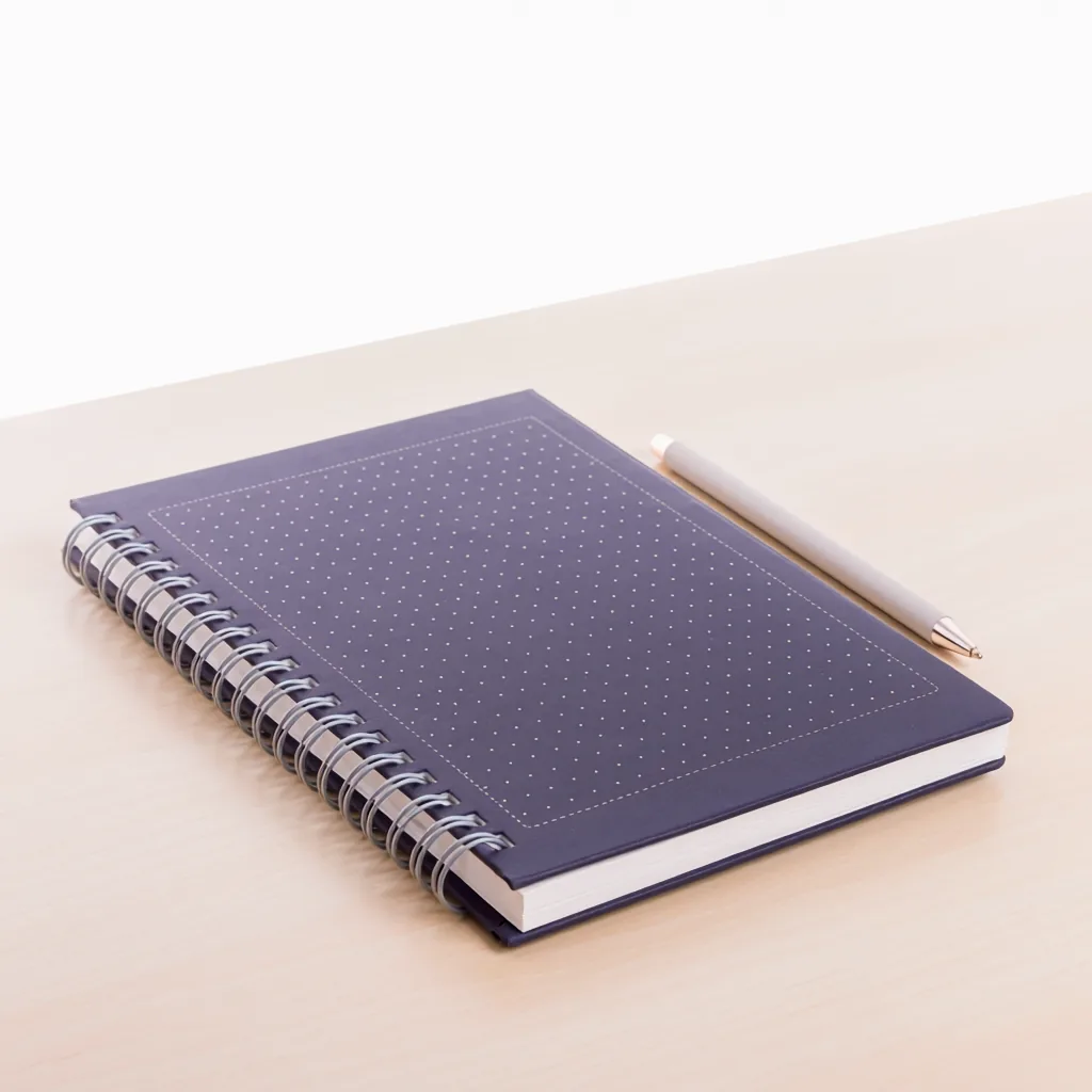 A notebook and pen on a desk, ready for audit notes
