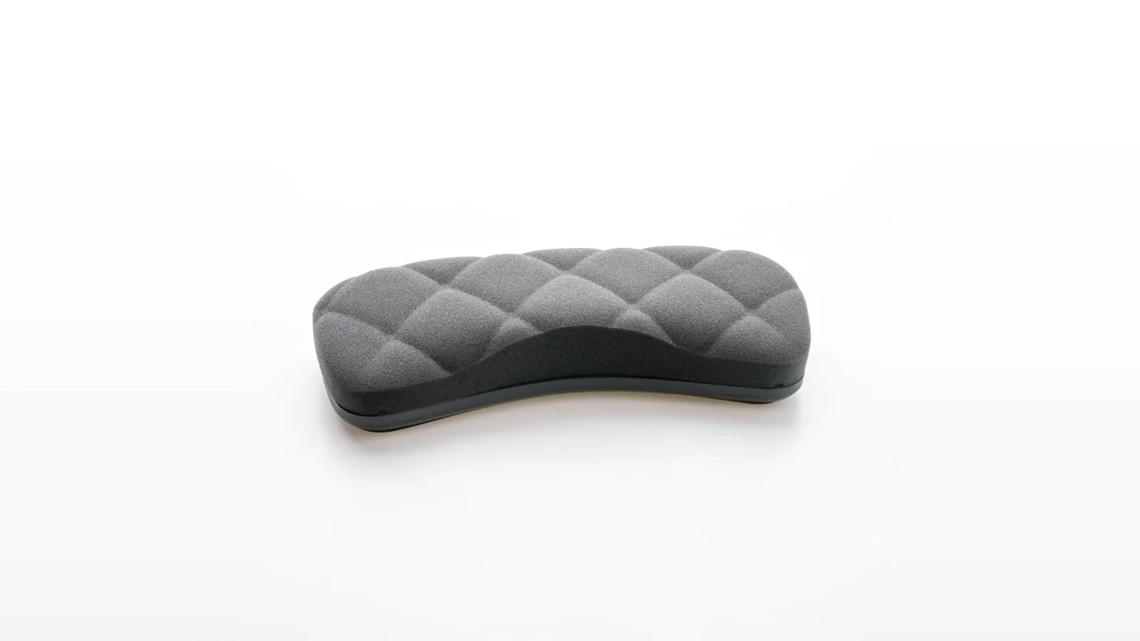 Grey quilted keyboard wrist rest on a white surface